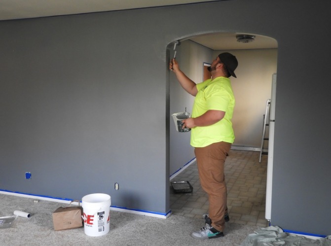 a man painting a house